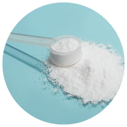 A neat pile of Monolaurin powder with a measuring scoop on top, placed on a light blue circular background.