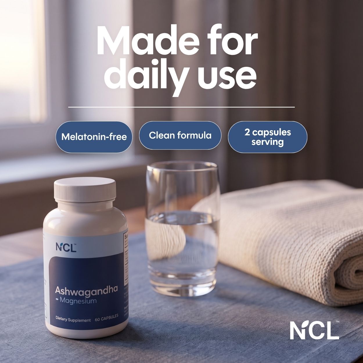 NCL Ashwagandha + Magnesium dietary supplement bottle shown on a tabletop next to a glass of water and a folded towel, with marketing text reading 'Made for daily use' and feature callouts.